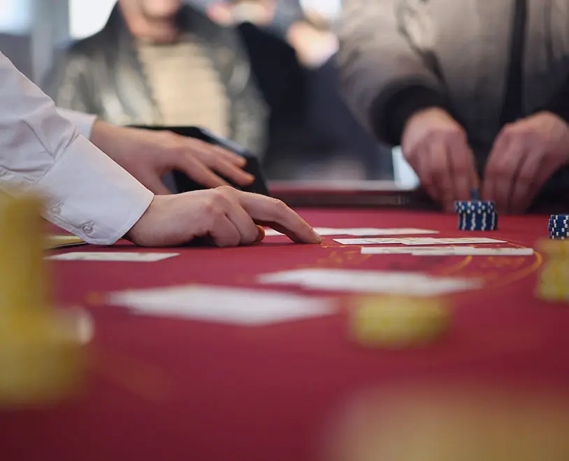 Dealer's hands on a blackjack table